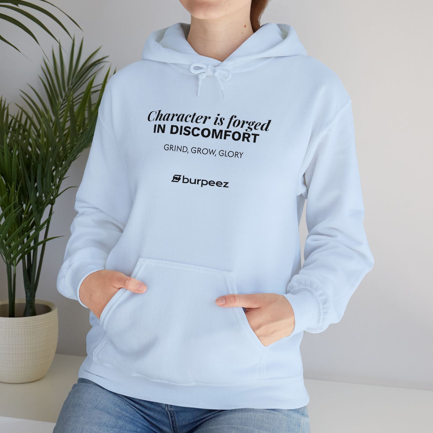 Hoodie unisex brodé « Character is forged in discomfort »