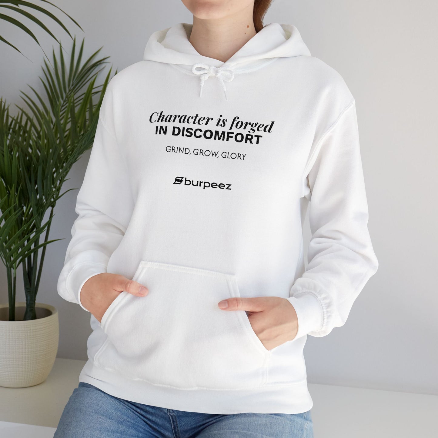 Hoodie unisex brodé « Character is forged in discomfort »